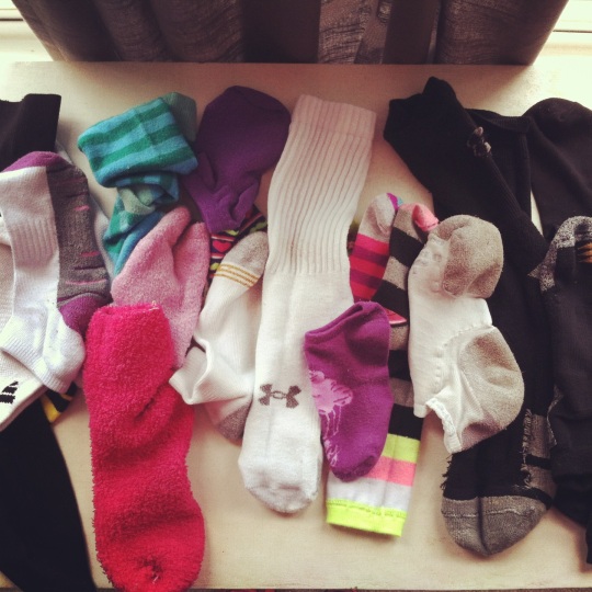 Several single socks on table.